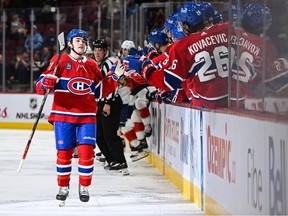 Canadiens centre Sean Farrell (57) celebrates his first NHL career goal with his teammates at the bench during the first period at Bell Centre in Monreal on Thursday, March 30, 2023.