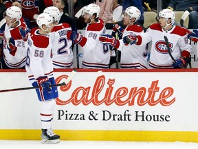 Montreal Canadiens right wing Jesse Ylonen (56) celebrates his goal with the Montreal bench against the Pittsburgh Penguins during the first period at PPG Paints Arena on March 14, 2023, in Pittsburgh.