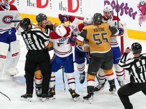 Canadiens and Golden Knights players tussle in front of Montreal's net during third period Sunday night in Las Vegas.