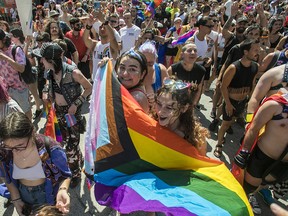People march in the Village in Montreal. When the Pride Parade was cancelled, a protest march sprung up.