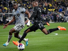 CF Montréal defender Kamal Miller (3) and Nashville SC midfielder Fafà Picault (7) close in on the ball in the first half of an MLS soccer game on Saturday, March 11, 2023, in Nashville.