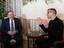 Quebec Premier François Legault, left, and Quebec City major Bruno Marchand chat at a ceremony, at city hall, in Quebec City, Thursday, March 2, 2023. Legault was made honorary mayor of Quebec City.