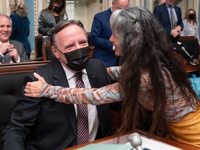 Coalition Avenir Québec MNA Marie-Louise Tardif hugs Quebec Premier François Legault as she is reintegrated in the caucus, Wednesday, March 29, 2023 at the legislature in Quebec City.