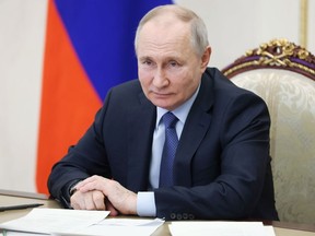 Russian President Vladimir Putin chairs a meeting on the social and economic development of Crimea and Sevastopol via a videoconference at the Moscow's Kremlin in Moscow, Russia, Friday, March 17, 2023.