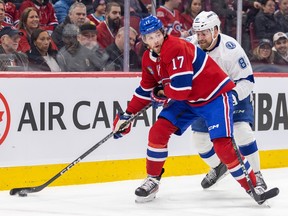Canadiens Josh Anderson controls the puck while being pressured from behind by the Lightning's Erik Cernak at the Bell Centre in March
