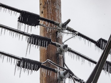 Icicles on electrical, cable and phone lines on 55th Avenue in the Lachine borough of Montreal Wednesday April 5, 2023.