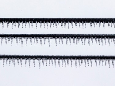 Icicles form on electrical, cable and phone lines on 55th Avenue in the Lachine borough of Montreal Wednesday April 5, 2023.