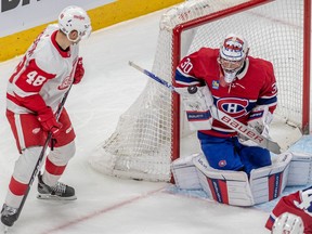 Red Wings' Alex Chiasson lurks as Canadiens goaltender Cayden Primeau makes a blocker save during a game earlier this month at the Bell Centre.