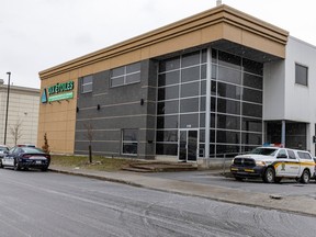 Police park outside Dix Étoiles Fruits et Légumes during a search related to a drug-trafficking investigation targeting the Hells Angels in Montreal on Wednesday April 5, 2023.