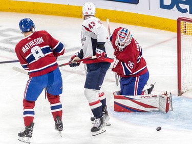 Montreal Canadiens goaltender Sam Montembeault (35) makes a pad save with Washington Capitals right wing Tom Wilson (43) and Montreal Canadiens defenseman Mike Matheson (8) on the doorstep during 1st period NHL action at the Bell Centre in Montreal on Thursday April 6, 2023.