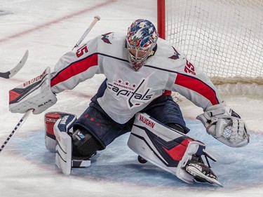 Washington Capitals goaltender Darcy Kuemper (35) sits on the puck after pinging off the goal post against the Montreal Canadiens during 2nd period NHL action at the Bell Centre in Montreal on Thursday April 6, 2023.