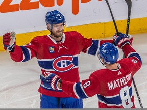 Montreal Canadiens right wing Joel Armia is congratulated by teammate Mike Matheson after scoring against Washington Capitals goaltender Darcy Kuemper at the Bell Centre in Montreal on Thursday April 6, 2023.