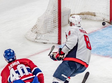 With Washington Capitals left wing Alex Ovechkin (8) checking, Montreal Canadiens right wing Joel Armia (40) watches his hat trick goal cross the goal line against Washington Capitals during 3rd period NHL action at the Bell Centre in Montreal on Thursday April 6, 2023.