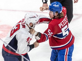Canadiens' Michael Pezzetta was forced to drop the gloves with Capitals tough guy Tom Wilson after delivering a clean check night at the Bell Centre.