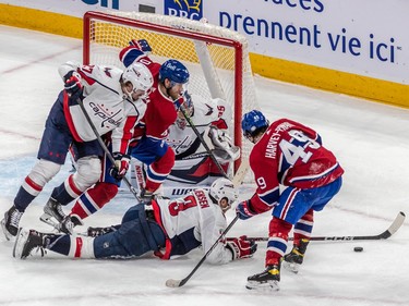 A scramble for the puck by Montreal Canadiens and Washington Capitals players in front of Washington Capitals goaltender Darcy Kuemper (35) during 2nd period NHL action at the Bell Centre in Montreal on Thursday April 6, 2023.