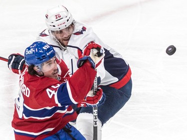 Montreal Canadiens left wing Rafael Harvey-Pinard (49) and Washington Capitals center Nic Dowd (26) eye the puck during 1st period NHL action at the Bell Centre in Montreal on Thursday April 6, 2023.