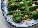 This broccolini dish is drizzled with lemon juice and seasoned with salt and pepper.
