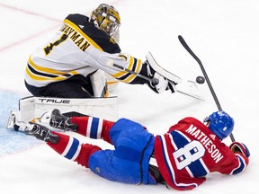 Canadiens' Mike Matheson slides past  Bruins goaltender Jeremy Swayman during first period Thursday night at the Bell Centre.