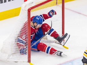 Canadiens defenceman Mike Matheson crashes into the net during the first period against the Boston Bruins Thursday night at the Bell Centre.