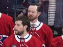Montreal Canadiens' Paul Byron, rear, joined team-mates including Josh Anderson on the bench following the team's last game of the NHL season against the Boston Bruins in Montreal Thursday April 13, 2023.