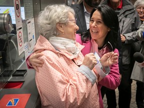 Montreal mayor Valérie Plante congratulates senior Micheline Roch at the Pie-IX metro station on Wednesday April 19, 2023 after announcing how free transit for seniors will work starting on July 1. Roch became the first senior to get her special Opus card for seniors.