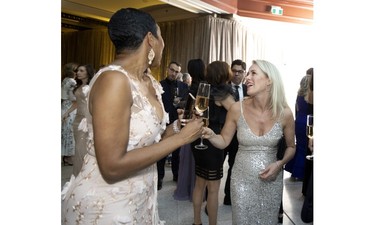 Renée-Claude Boivin shares a laugh with Varda Etienne at the Daffodil Ball in Montreal April 20, 2023.