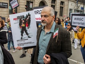 People take part in a march/rally Saturday, April 29, 2023 in Montreal to protest against the regime in Iran and to demand the Canadian government declare Iran’s Islamic Revolutionary Guard Corps (IRGC) a terrorist organization.