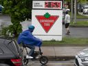 One way to avoid the high price of gasoline as inflation takes hold in Quebec is riding a bike past the gas station in Montreal on May 19, 2022. 