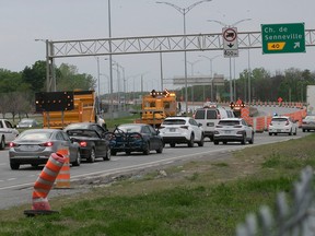 Cars are diverted away from the Île-aux-Tourtes Bridge in May 2021 because of emergency repairs.