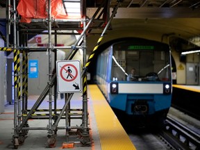 An STM train arrives at the Beaudry métro station during construction in 2019.
