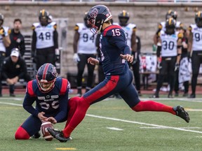 Montreal Alouettes punter Joseph Zema (36) holds for Montreal Alouettes kicker David Côté (15) during 2nd half CFL Eastern Conference semifinal action at Percival Molson Stadium in Montreal on Sunday Nov. 6, 2022.