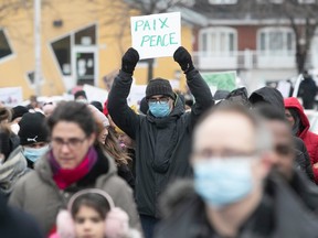 People hold a vigil in Anjou on Saturday December 11, 2021 in memory of Hani Ouahdi and to denounce street violence.