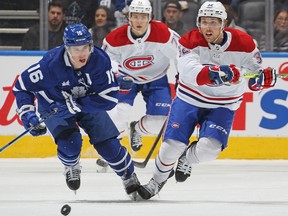 Canadiens' Rem Pitlick skates against Mitchell Marner of the Toronto Maple Leafs at Scotiabank Arena on Saturday, April 8, 2023, in Toronto.
