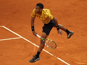 Félix Auger-Aliassime of Canada serves against Dusan Lajovic of Serbia during their second-round match on day six of the Mutua Madrid Open at La Caja Magica on April 29, 2023 in Madrid, Spain.