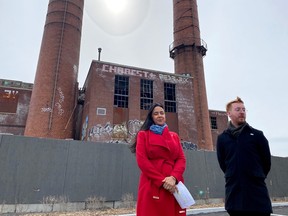 East-end city councillors Alba Zúñiga Ramos, left, and Julien Hénault-Ratelle stand in front of the Dickson incinerator in Montreal on Tuesday, April 11, 2023.