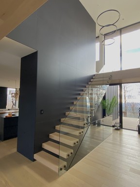 Interior designer Catlin Stothers recommends that staircases be in the same species of wood as the floors.