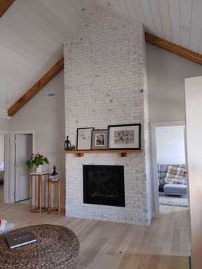 The faux brick wall coverings are light and heat resistant, making them for a fireplace mantel area.