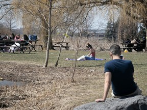 Montrealers enjoy the warm weather at Jarry Park on Thursday April 13, 2023.