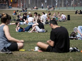 Montrealers enjoy the warm weather at Jeanne-Mance Park April 13, 2023.