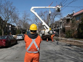 A Hydro-Québec crew and a team from Holland Power in Ontario replace a power transformer in Rosemont April 10, 2023.