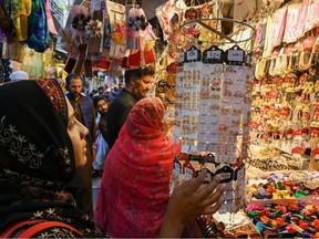 Women buy jewellery at a market ahead of Eid ul-Fitr, which marks the end of the holy month of Ramadan, in Rawalpindi, Pakistan.