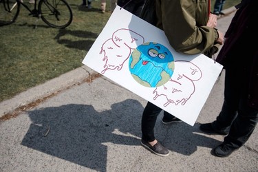 Protesters wait for the march to begin during the Earth Day Protest on April 22, 2023, in Montreal.