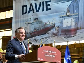 Quebec Premier François Legault speaks to Davie shipyard workers as he and Prime Minister Justin Trudeau (not shown) announce major investments in shipbuilding, at the Davie shipyard in Lévis on Tuesday, April 4, 2023.