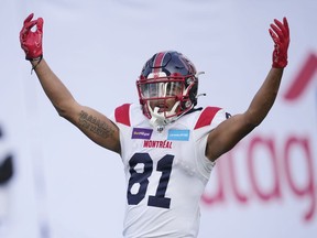 Montreal Alouettes wide receiver Tyson Philpot (81) celebrates his touchdown against the Toronto Argonauts during first half CFL Eastern Final football action in Toronto on Sunday, November 13, 2022. Last year, the Montreal Alouettes receiver had to adjust to playing without his twin brother, Jalen, a rookie receiver with the Calgary Stampeders.&ampnbsp;THE CANADIAN PRESS/Mark Blinch