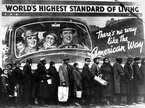 Christopher Paul Curtis had this famous photo in mind when he wrote one scene in his Newbery Medal-winning novel Bud, Not Buddy. The Margaret Bourke-White photo shows Kentucky flood victims lined up for help in 1937. They don't have much in common with the family on the sign.