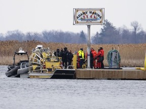 Searchers dock at a marina in Akwesasne on Friday, March 31, 2023. The search continues for a man missing from the Mohawk community of Akwesasne in an area of the St. Lawrence River where the bodies of eight migrants were recovered last week.