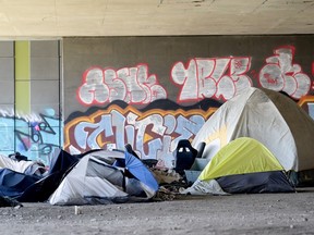 A homeless camp is shown beneath an overpass in Montreal, Friday, April 14, 2023.