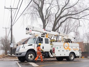 A Hydro Quebec truck is shown on a street following an ice storm in Montreal, Thursday, April 6, 2023.