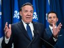 Premier François Legault responds to reporters questions after Bill 96 was adopted in May 2022, alongside Simon Jolin-Barrette, then the minister responsible for the French language, and now the justice minister.