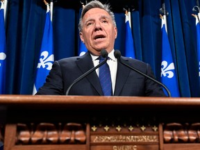 Quebec Premier François responds to reporters' questions at a news conference to defend his decision to cancel the tunnel project at the legislature in Quebec City, Tuesday, April 25, 2023.